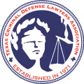Logo of Texas Criminal Defense Lawyers Association featuring a blindfolded woman with scales of justice and surrounding text.